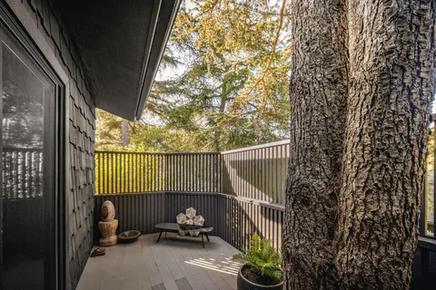 a bathroom with a double vanity sink a mirror and a bathtub
