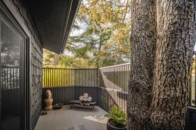 a bathroom with a double vanity sink a mirror and a bathtub