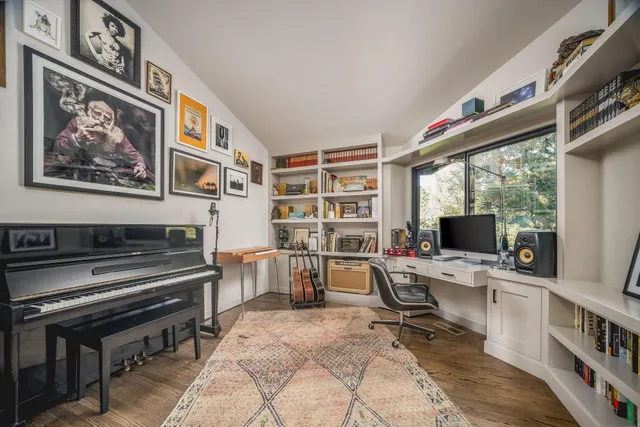 a bedroom with a bed and a view of bathroom