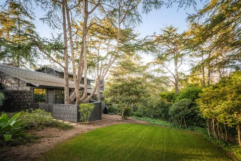 an aerial view of residential building with parking space