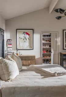 a spacious bedroom with a bed and a fireplace