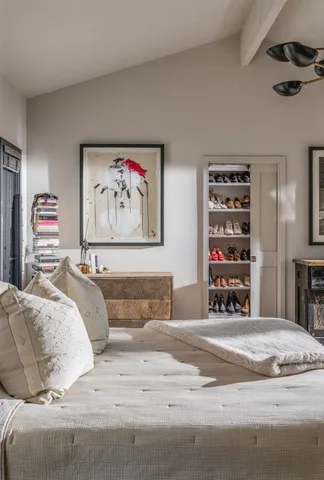 a spacious bedroom with a bed and a fireplace