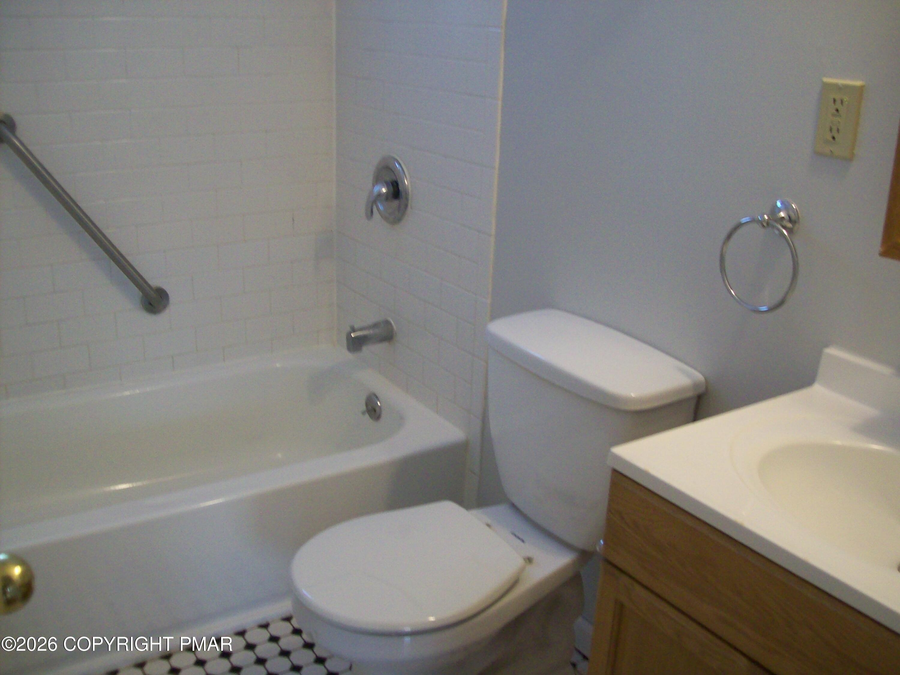 522 Apache Road East Stroudsburg, PA 18302 - Photo 11 of 23 a white toilet sitting next to a bath tub
