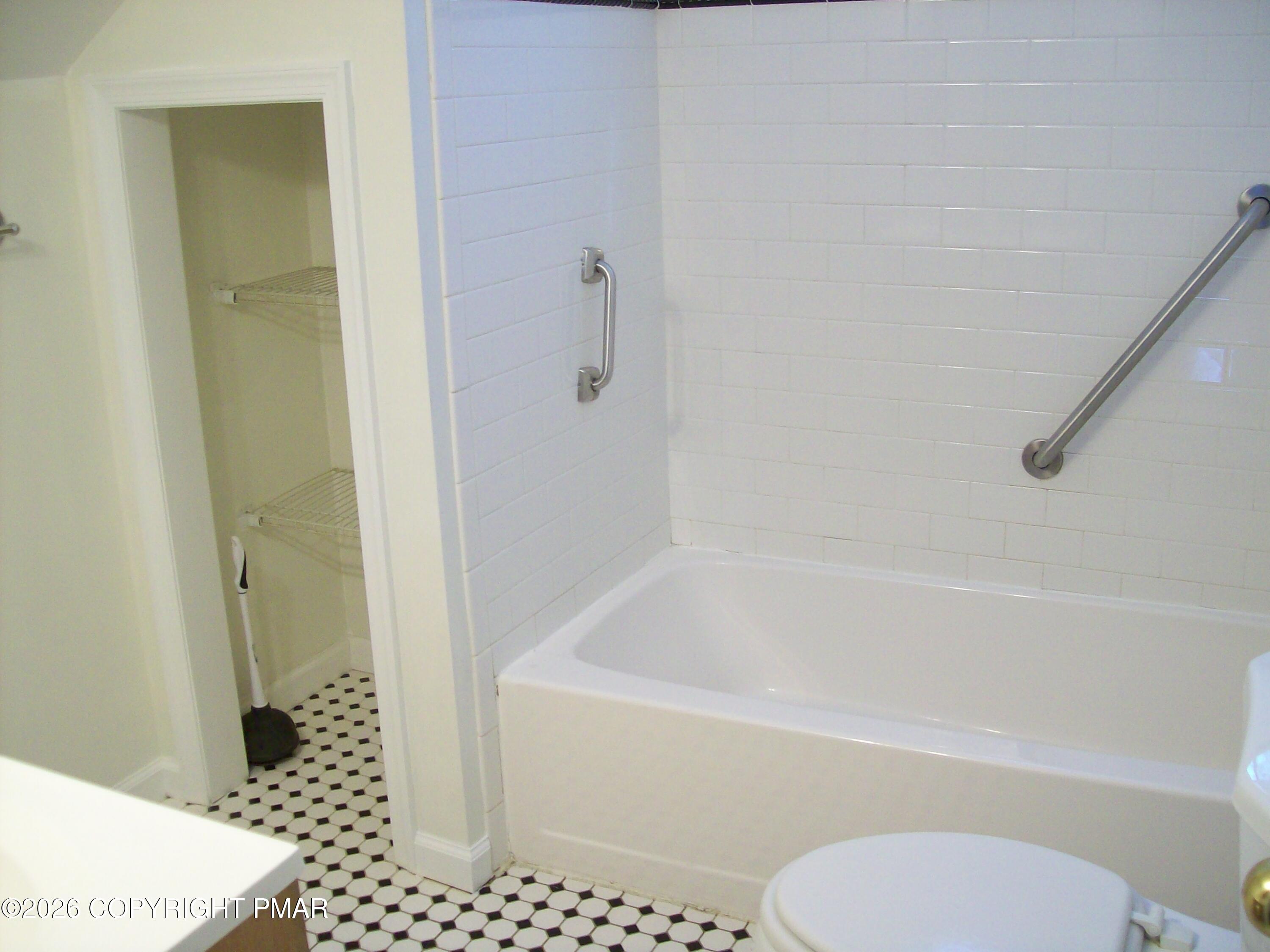 522 Apache Road East Stroudsburg, PA 18302 - Photo 14 of 23 a white bath tub sitting next to a toilet
