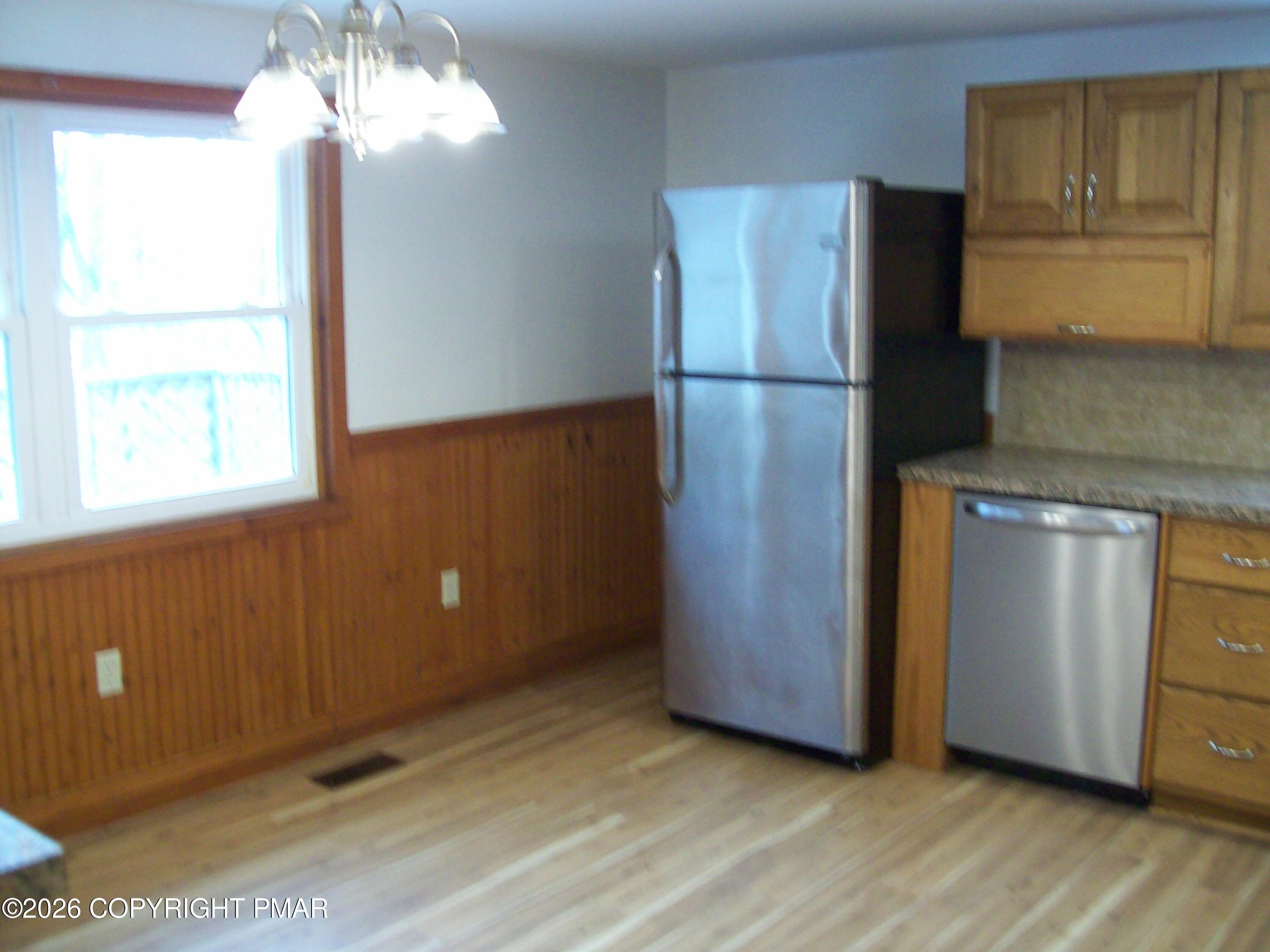 522 Apache Road East Stroudsburg, PA 18302 - Photo 4 of 23 a kitchen with stainless steel appliances granite countertop a refrigerator and a stove