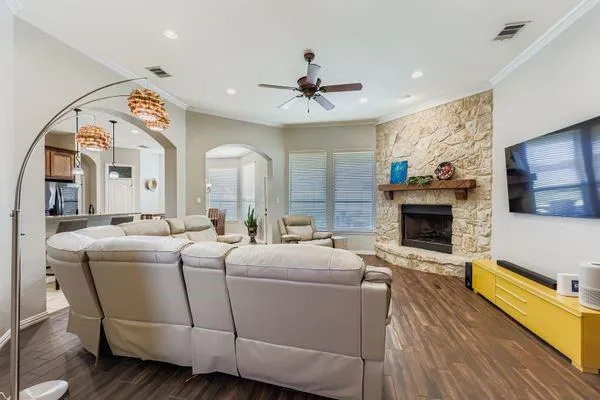 a living room with furniture and a flat screen tv