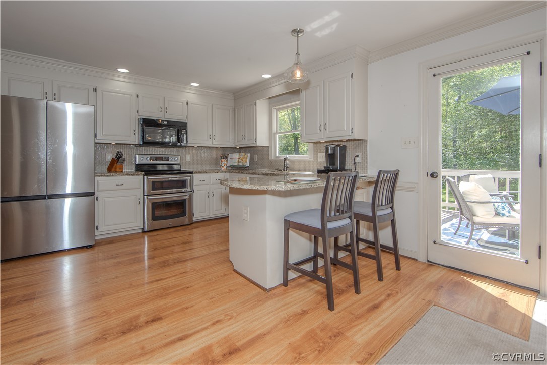 11360 Glendevon Road Chesterfield, VA 23838 - Photo 8 of 43 Kitchen featuring white cabinets, granite counter