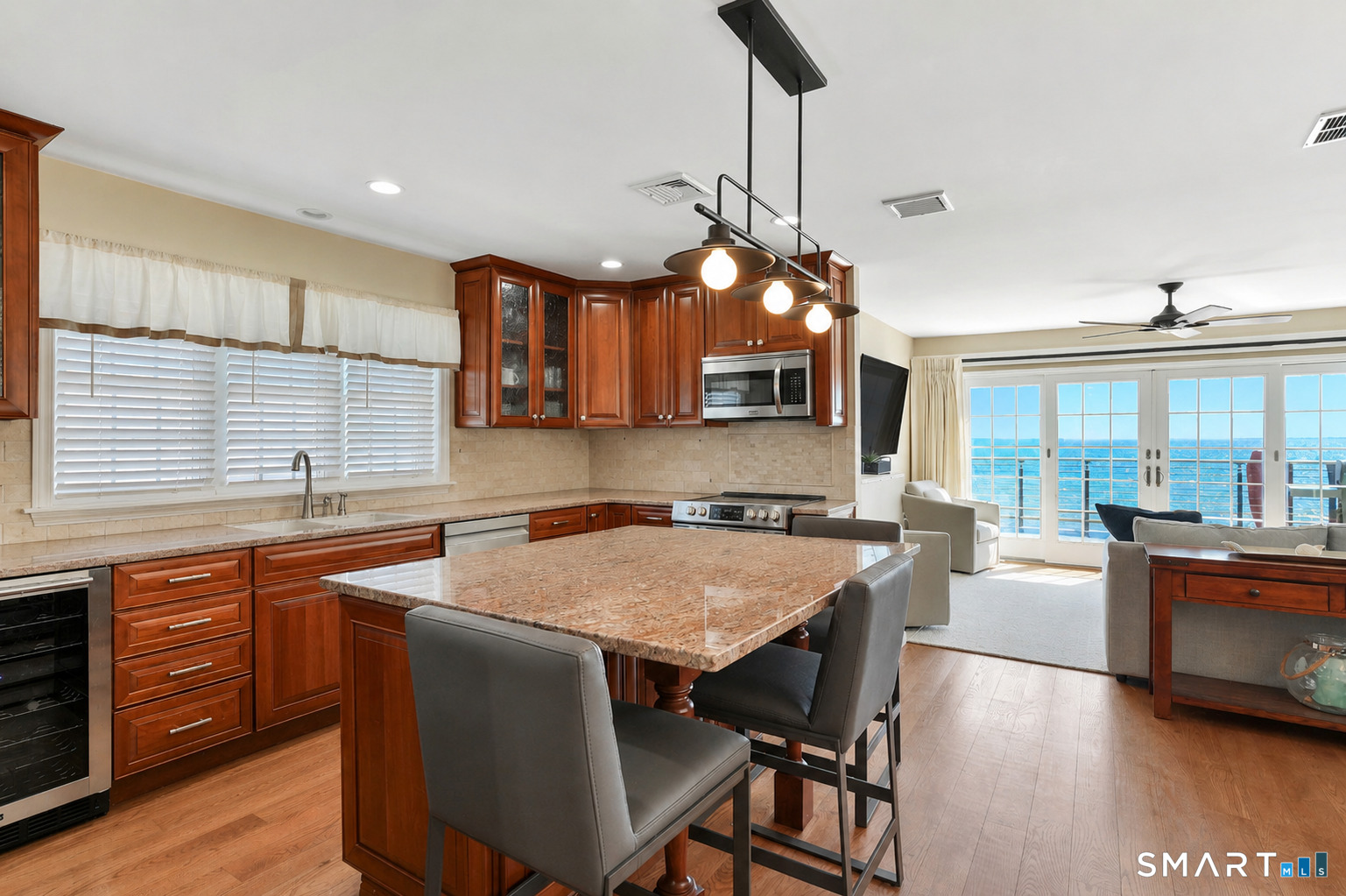 40 Pond Road Old Lyme, CT 06371 - Photo 12 of 35 a kitchen with stainless steel appliances granite countertop a sink a stove and a refrigerator