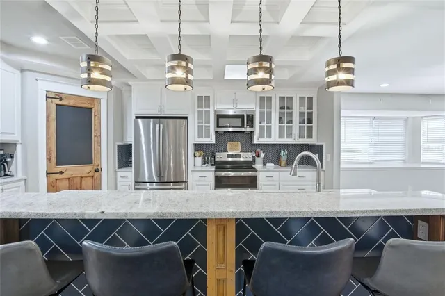 a room with furniture pool table and flat screen tv