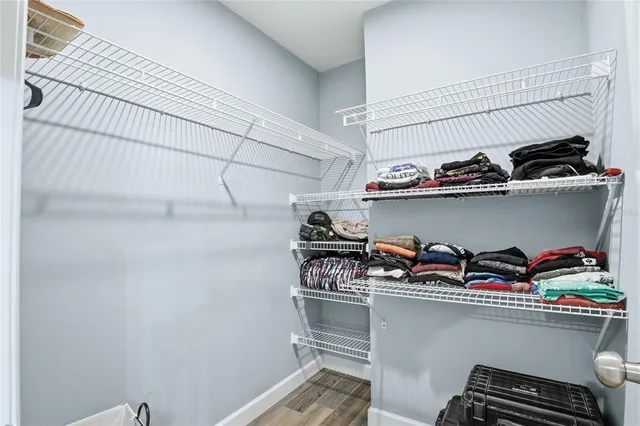 a view of a swimming pool with a yard in front of it