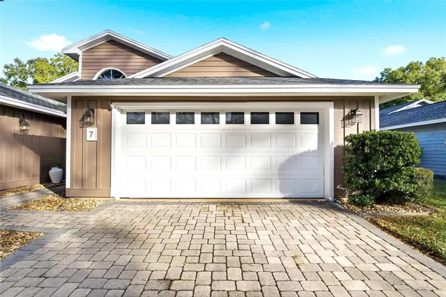 an aerial view of a house with a swimming pool
