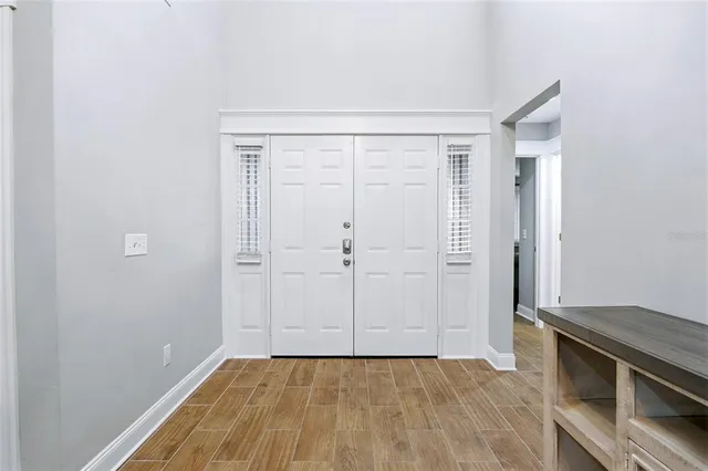 an empty room with wooden floor