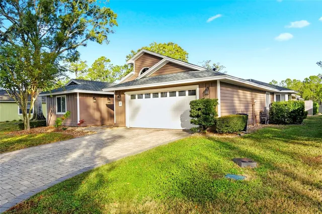an aerial view of a house with a garden