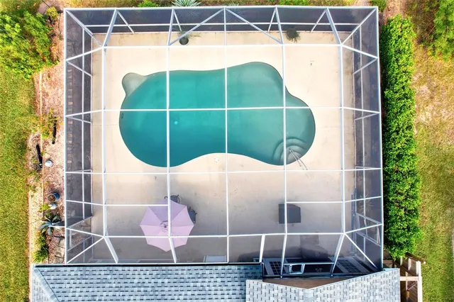 an aerial view of a house with a lake view