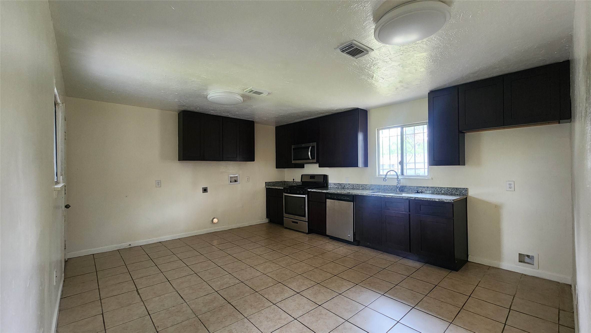 6114 Hartwick Road Houston, TX 77016 - Photo 4 of 14 a large kitchen with cabinets