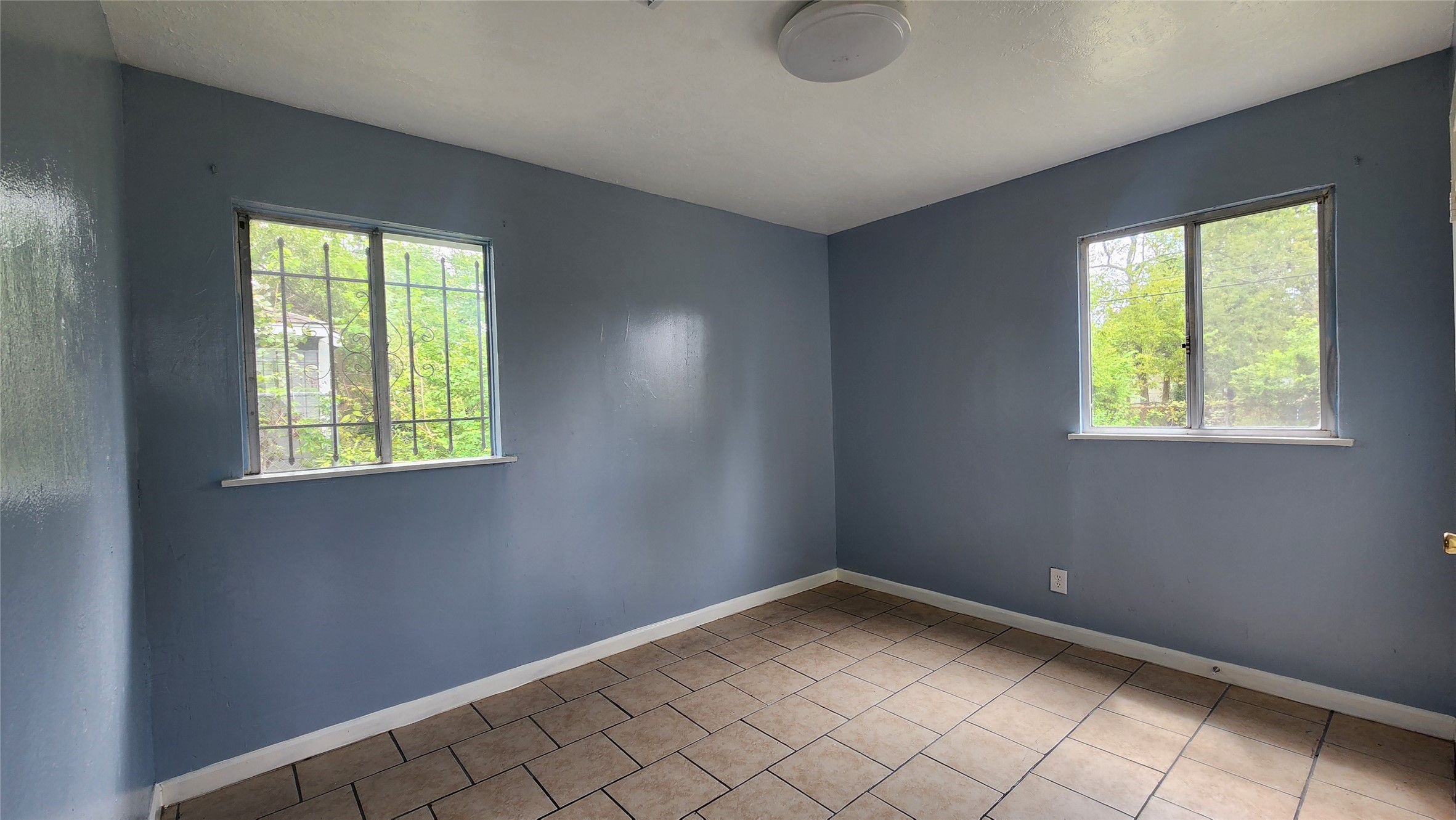 6114 Hartwick Road Houston, TX 77016 - Photo 8 of 14 a view of an empty room with a window