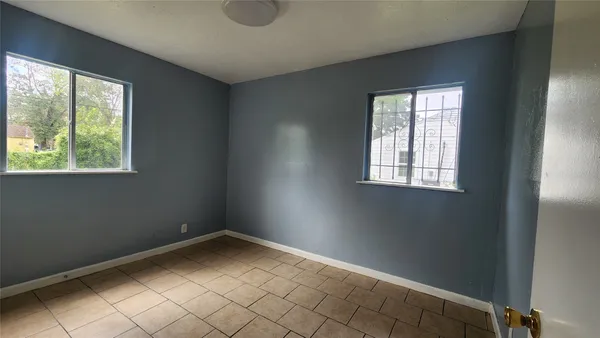 an empty room with windows