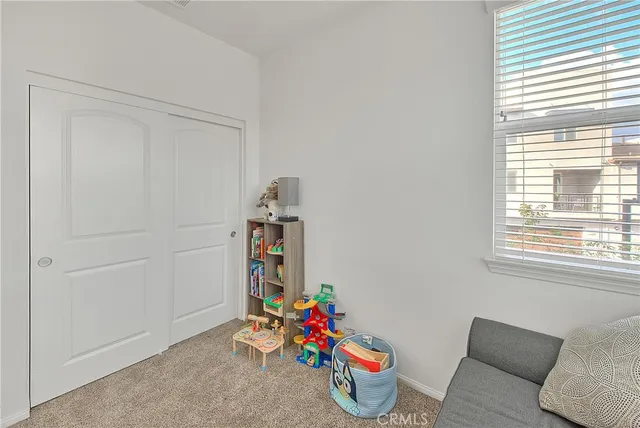 a bathroom with a sink a toilet and window
