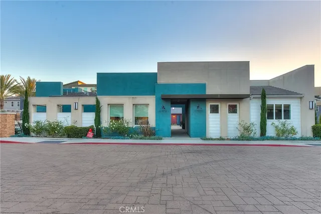 a view of a swimming pool with outdoor seating
