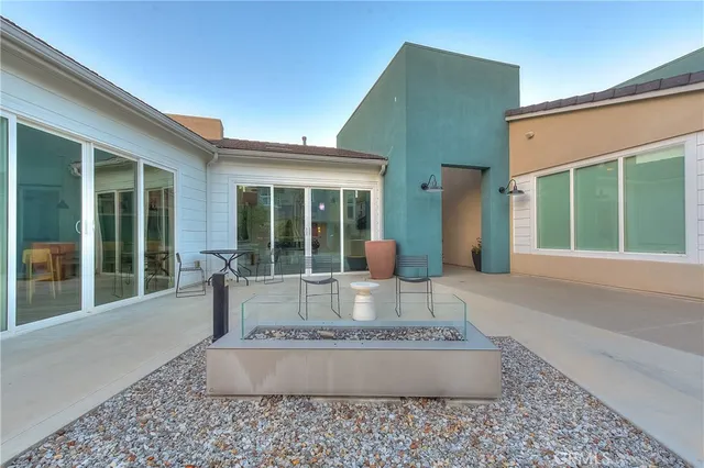 a sign broad in front of the red brick house