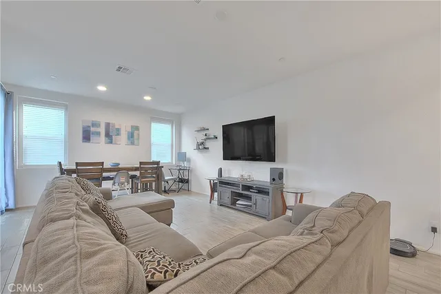 a kitchen with stainless steel appliances granite countertop a refrigerator a sink a stove a microwave and island