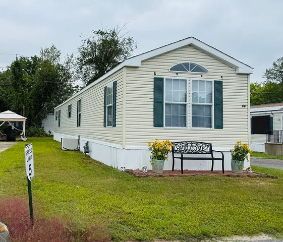 a front view of house with garden