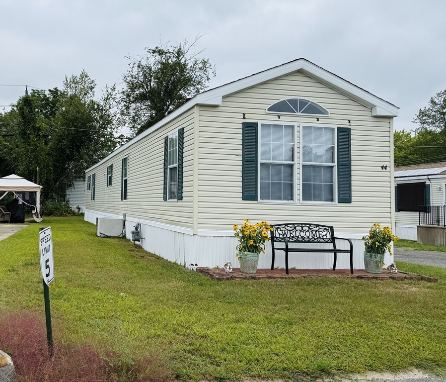 a front view of house with garden