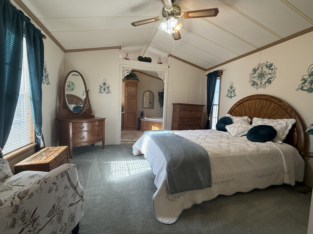 268 Palmer Road, Unit 44 Monson, MA 01057 - Photo 14 of 34 a bedroom with a bed mirror and window