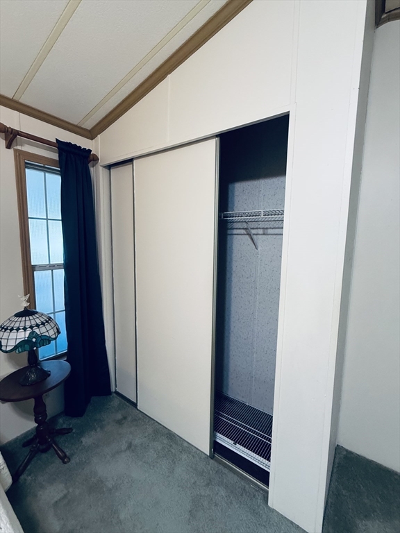 268 Palmer Road, Unit 44 Monson, MA 01057 - Photo 16 of 34 a view of room with hardwood floor and closet