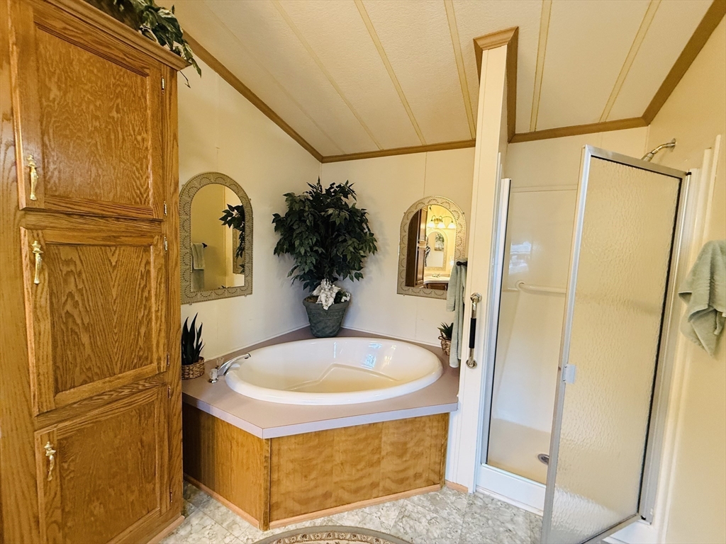 268 Palmer Road, Unit 44 Monson, MA 01057 - Photo 19 of 34 a bathroom with a tub and shower