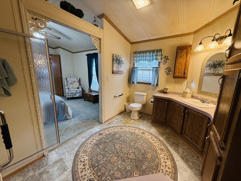 268 Palmer Road, Unit 44 Monson, MA 01057 - Photo 20 of 34 a view of a bathroom with a sink and mirror