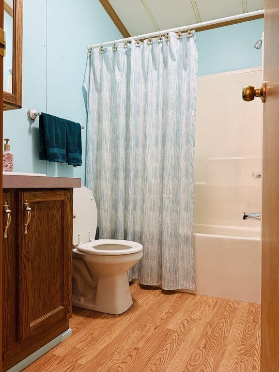 268 Palmer Road, Unit 44 Monson, MA 01057 - Photo 24 of 34 a bathroom with a toilet a sink and curtain
