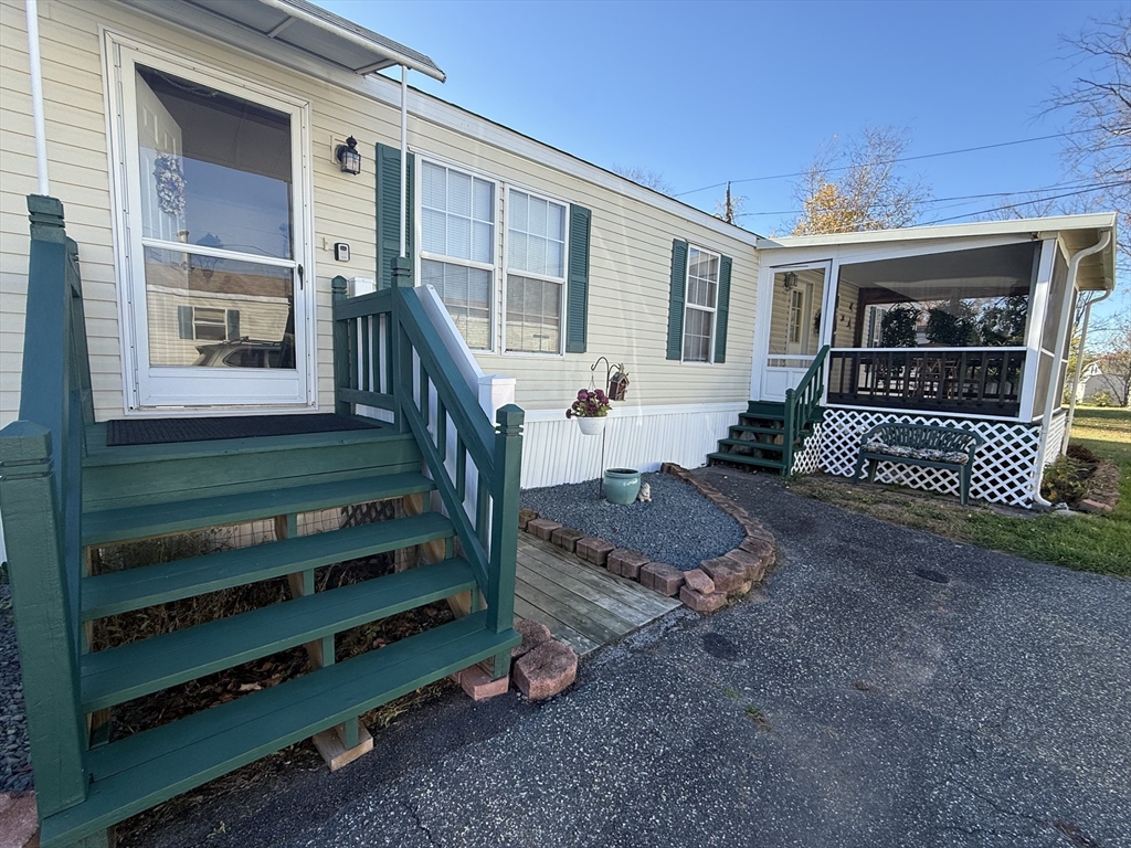 268 Palmer Road, Unit 44 Monson, MA 01057 - Photo 30 of 34 a front view of a house with a yard