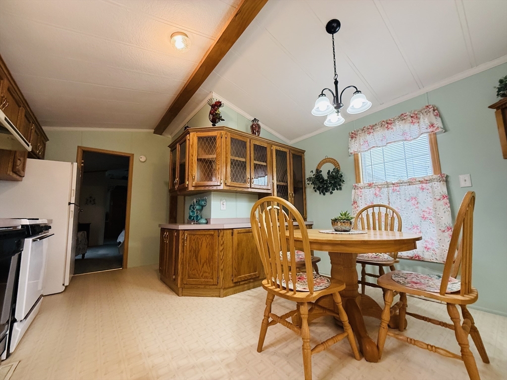 268 Palmer Road, Unit 44 Monson, MA 01057 - Photo 10 of 34 a view of a dining room with furniture window and wooden floor