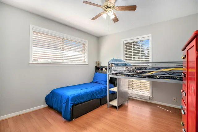 a living room with stainless steel appliances kitchen island granite countertop furniture and a window