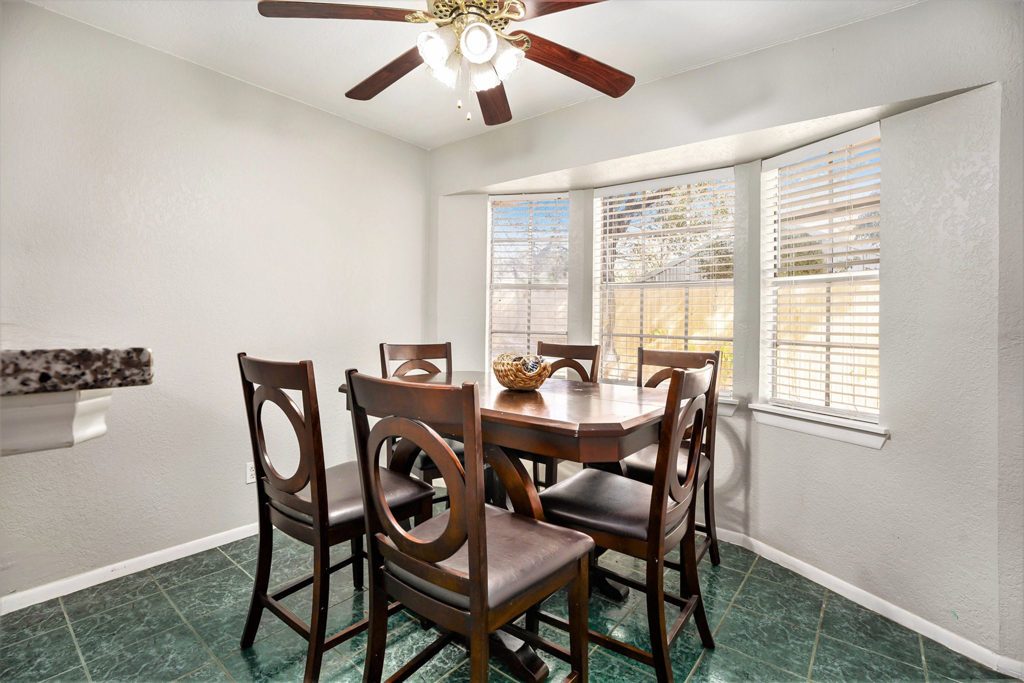 1027 Sycamore Street La Marque, TX 77568 - Photo 7 of 15 a view of a dining room with furniture and a window