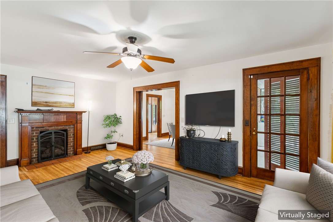321 South Pine Street Walhalla, SC 29691 - Photo 7 of 32 Hardwood floors and a detailed fireplace create a warm and inviting living space.