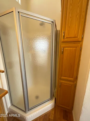 a bathroom with a glass door