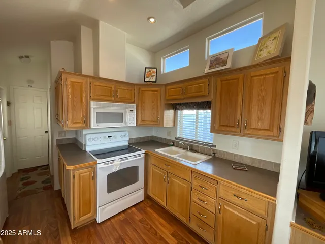 a kitchen with stainless steel appliances granite countertop a stove and a refrigerator