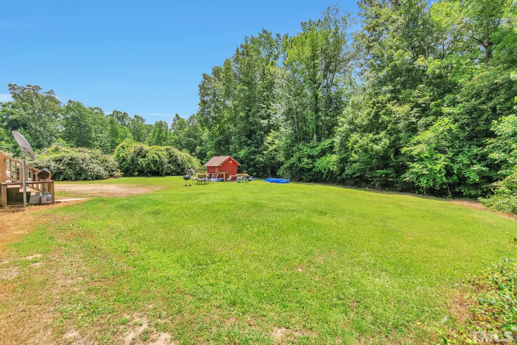 720 Whitley Road Middlesex, NC 27557 - Photo 3 of 25 a view of an outdoor space and swimming pool