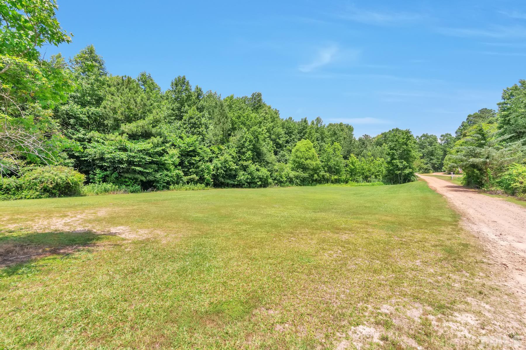 720 Whitley Road Middlesex, NC 27557 - Photo 5 of 25 a view of yard with swimming pool and green space