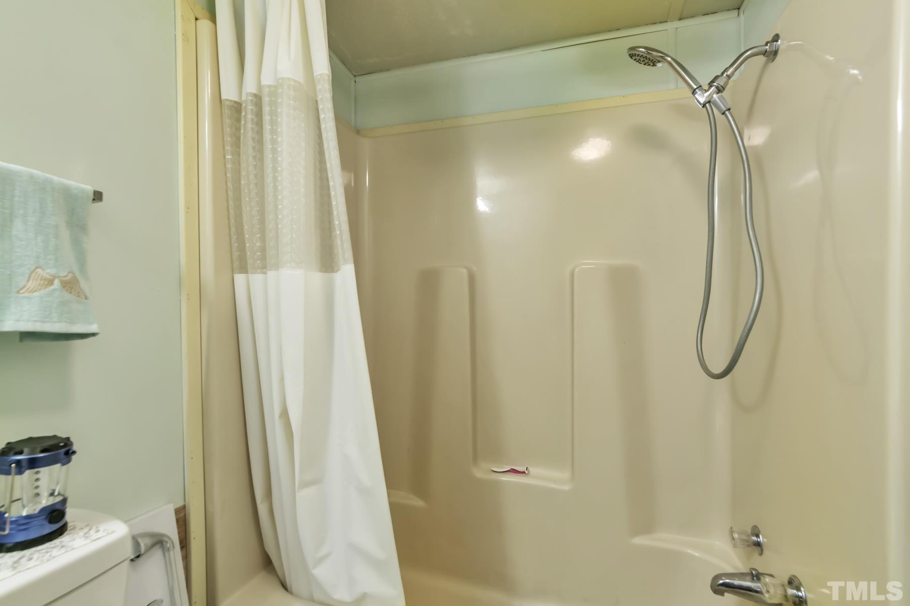 720 Whitley Road Middlesex, NC 27557 - Photo 10 of 25 a bathroom with a shower