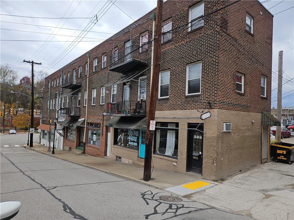 2215 Ardmore Boulevard Forest Hills, PA 15221 - Photo 2 of 8 a front view of a building with street