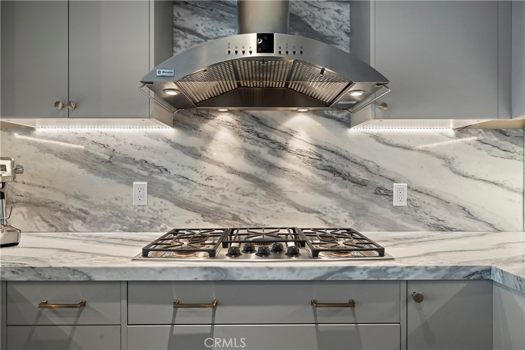 3141 Michelson Drive, Unit 907 Irvine, CA 92612 - Photo 12 of 48 a stove top oven sitting inside of a kitchen