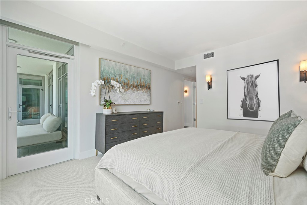 3141 Michelson Drive, Unit 907 Irvine, CA 92612 - Photo 17 of 48 a bedroom with a bed and a painting on the wall