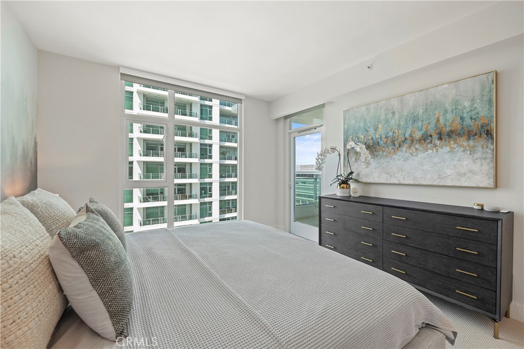 3141 Michelson Drive, Unit 907 Irvine, CA 92612 - Photo 19 of 48 a bedroom with a bed and a window