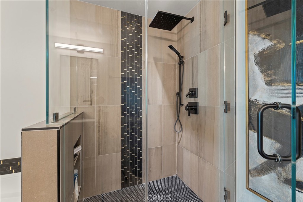 3141 Michelson Drive, Unit 907 Irvine, CA 92612 - Photo 22 of 48 walk in closet with wooden floor and mirror