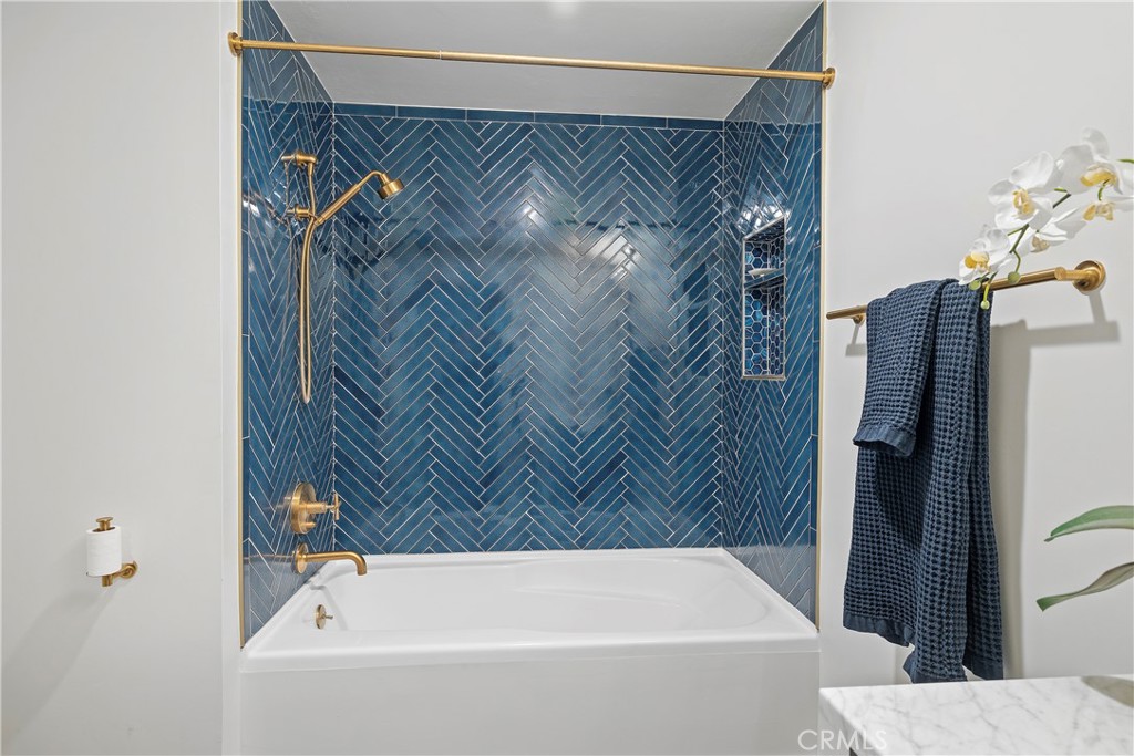 3141 Michelson Drive, Unit 907 Irvine, CA 92612 - Photo 29 of 48 a bathroom with a bathtub and shower