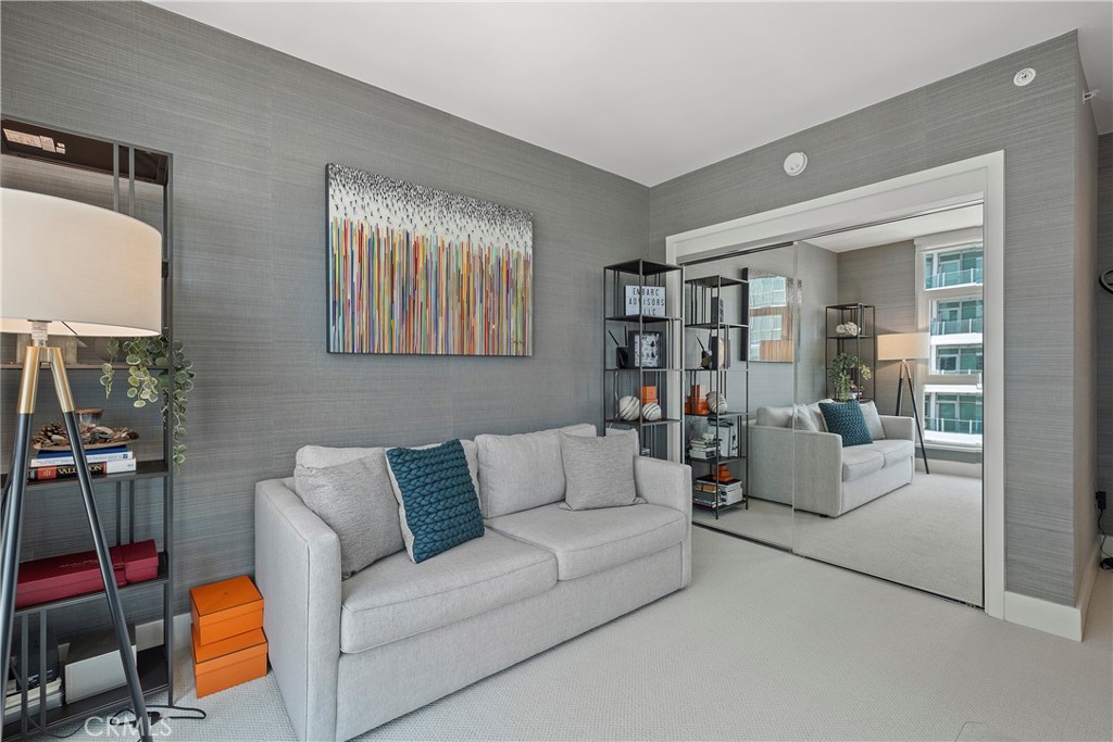 3141 Michelson Drive, Unit 907 Irvine, CA 92612 - Photo 31 of 48 a living room with furniture and a wooden floor