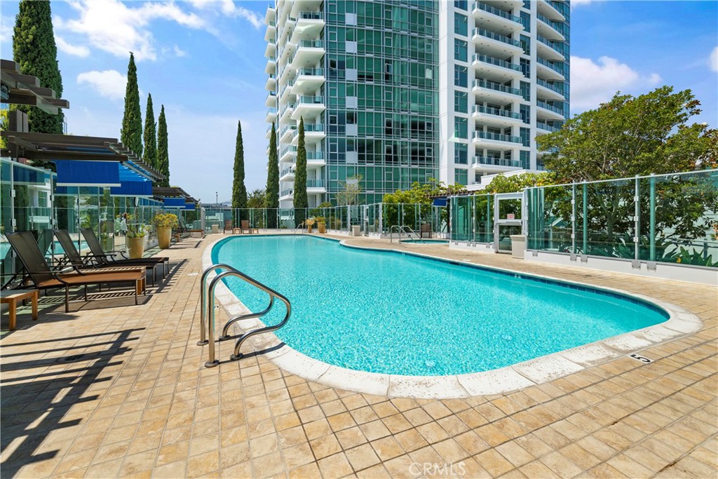 3141 Michelson Drive, Unit 907 Irvine, CA 92612 - Photo 44 of 48 a view of a swimming pool with a patio